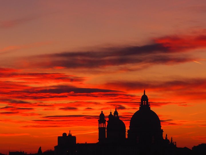 sun setting behind the Salute church