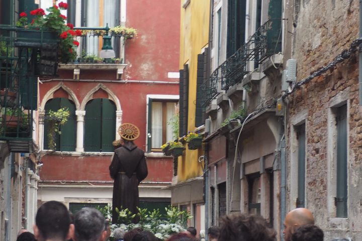 procession through a narrow street